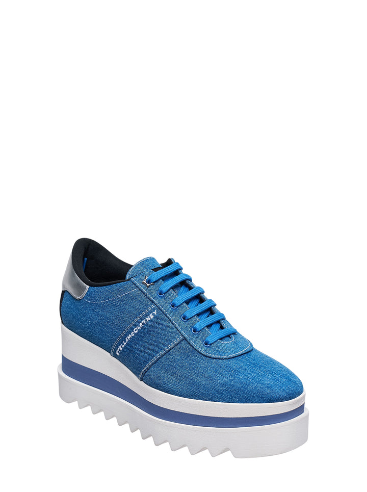 Stella McCartney Sneakelyse flatform sneaker in vintage washed blue denim with embroidered logo, silver heel counter, and a stacked white and blue striped platform sole with serrated tread - view 2