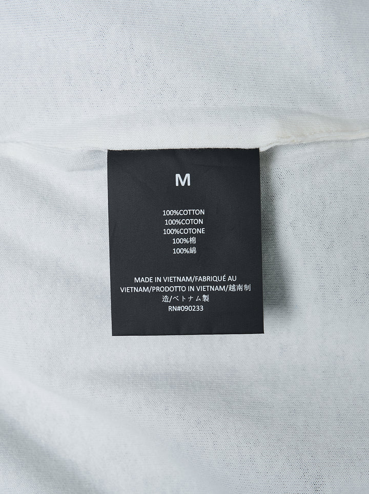 Fear of God ESSENTIALS Classic Double Layer Tee in black with white undertee at the neckline and hem and tonal embroidered logo at the chest - view 3