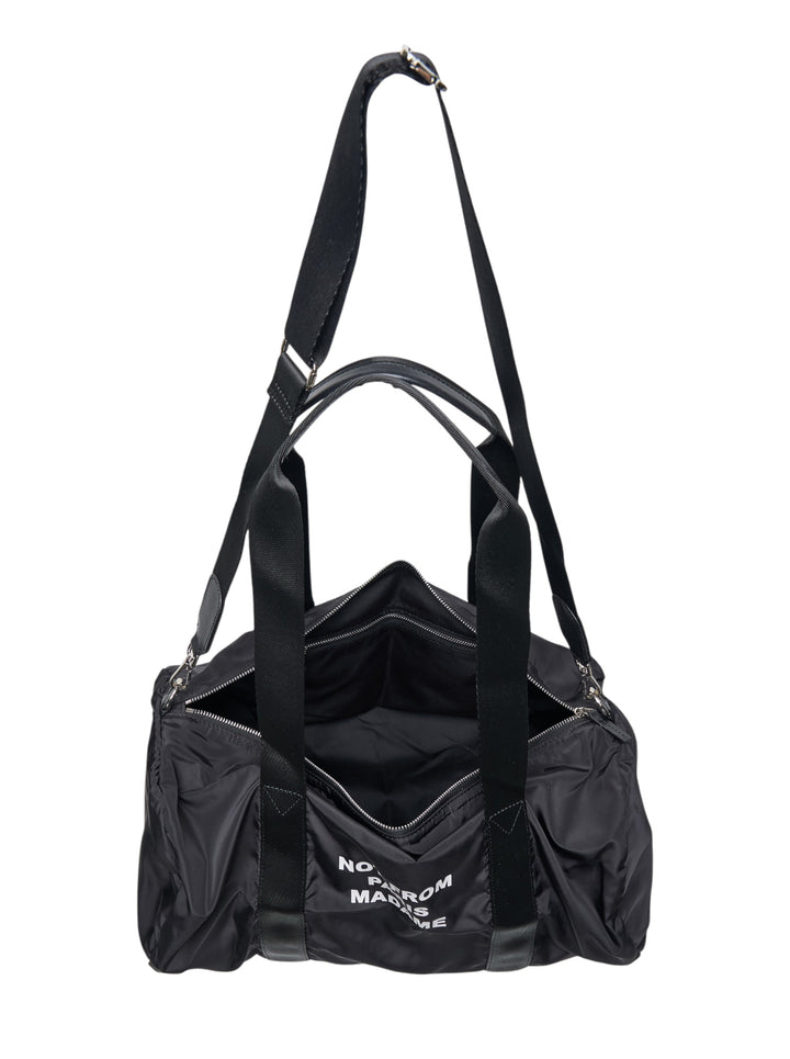 Drôle de Monsieur black nylon cylindrical gym bag with 'Not From Paris Madame' slogan print, dual handles, and detachable shoulder strap - view 3