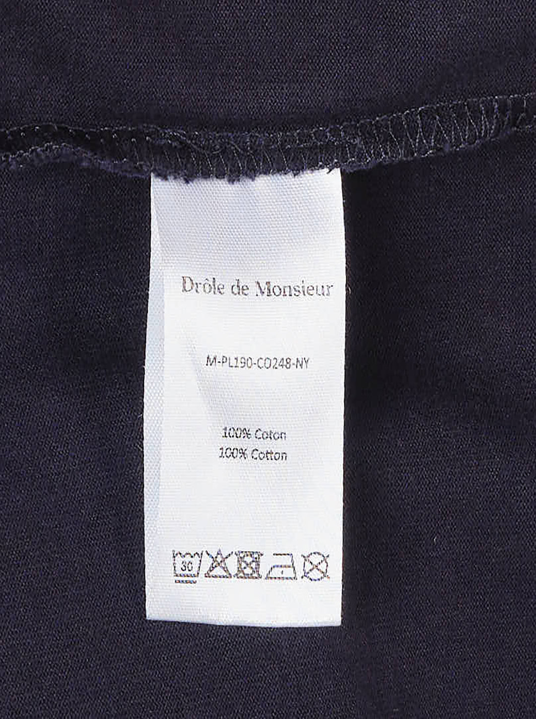 Drôle de Monsieur Slogan Long Sleeve Polo in navy with contrast white collar, striped ribbed cuffs, and 'Not From Paris Madame' chest embroidery - view 4