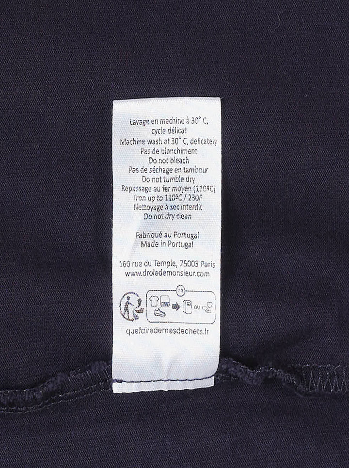 Drôle de Monsieur Slogan Long Sleeve Polo in navy with contrast white collar, striped ribbed cuffs, and 'Not From Paris Madame' chest embroidery - view 5
