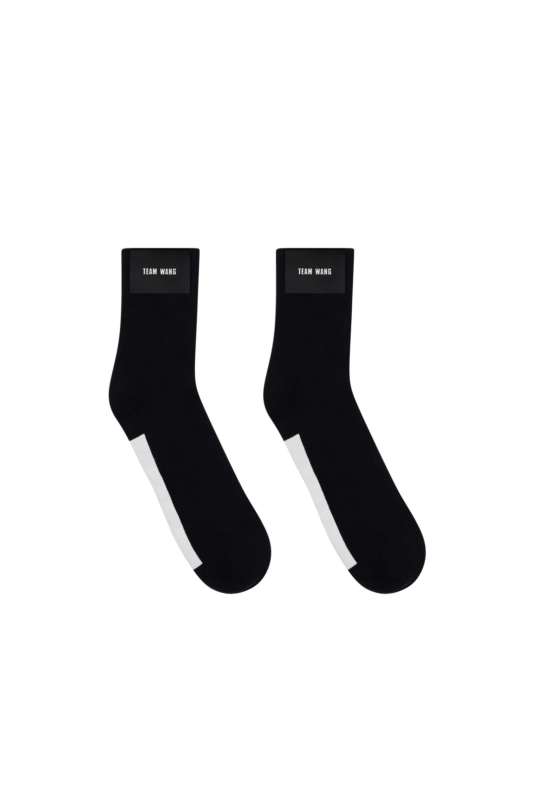 TEAM WANG design Original 1 Crew Socks in black with contrast white heel and woven brand label at the cuff, shown as a pair on a white background