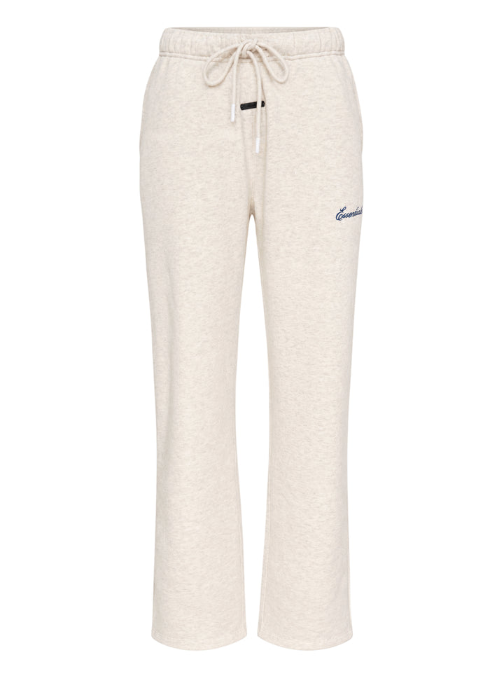 Fear of God ESSENTIALS women's slim sweatpants in heathered oat with drawcord waist, black logo tab and navy embroidered script logo
