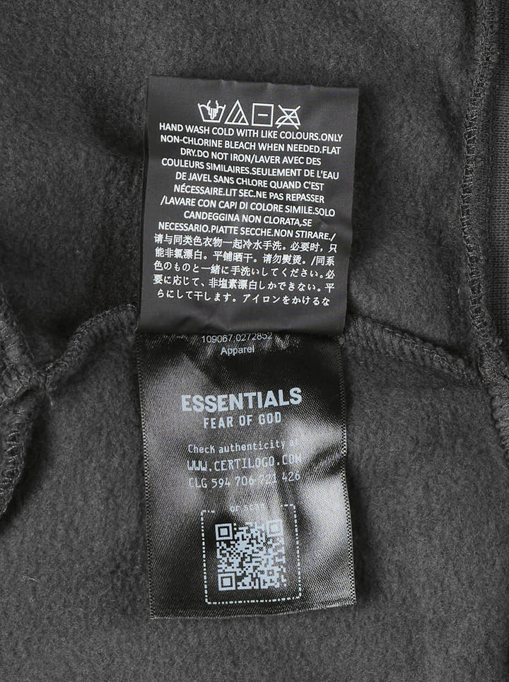 Fear of God Essentials women's modern cropped zip hoodie in washed black with embroidered script Essentials logo on the chest and front hand pockets - view 6
