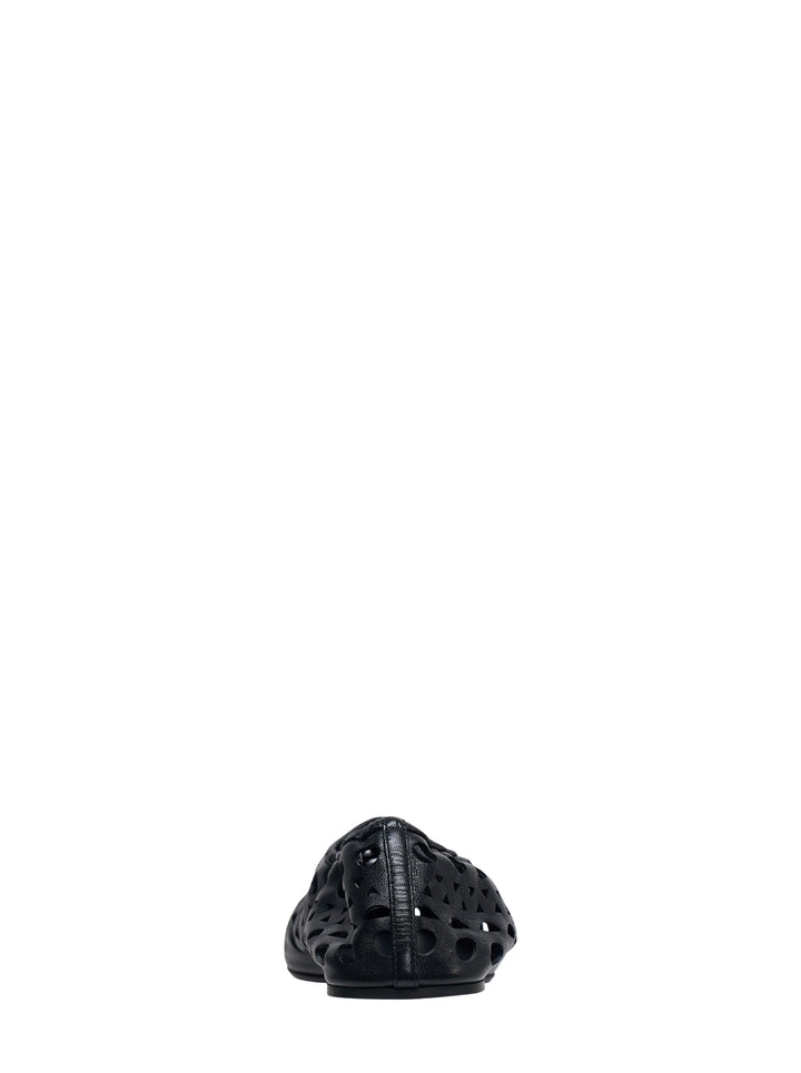 Alaïa Neo Vienne black nappa lambskin flat shoe with all-over laser-cut perforations and a rounded square toe, shown in profile view - view 3