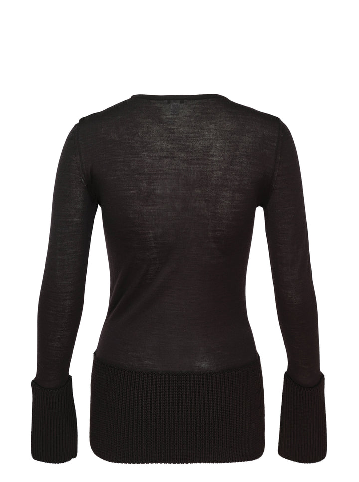 Alaïa long sleeve multi-gauge crew neck top in black sheer fine knit with contrast chunky ribbed hem and oversized turned-back cuffs, front view on white background - view 2