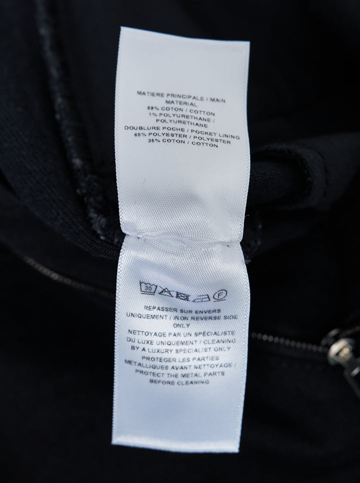 Alaïa black denim round pants with a high waist, five-pocket design and sculpted curved leg, shown from the front - view 3