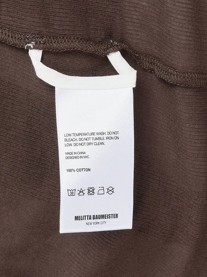 Melitta Baumeister Double Layer Turtleneck Top in dark brown, featuring a sheer long-sleeve base with ribbed turtleneck collar and an opaque sleeveless tank overlay with extended sheer hem - view 3