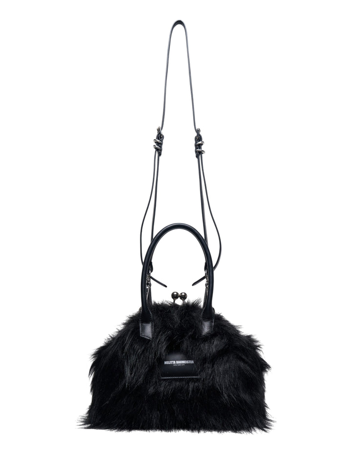 Melitta Baumeister Fluffy Clasp Bag in black long-pile faux fur with kiss-lock clasp, leather top handles, and adjustable crossbody strap