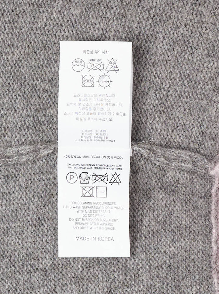 Glowny Raccoon Hazy Layered V-Neck Sweater in heather grey with blush pink contrast trim at the neckline, hem, and cuffs, displayed on a white background - view 3