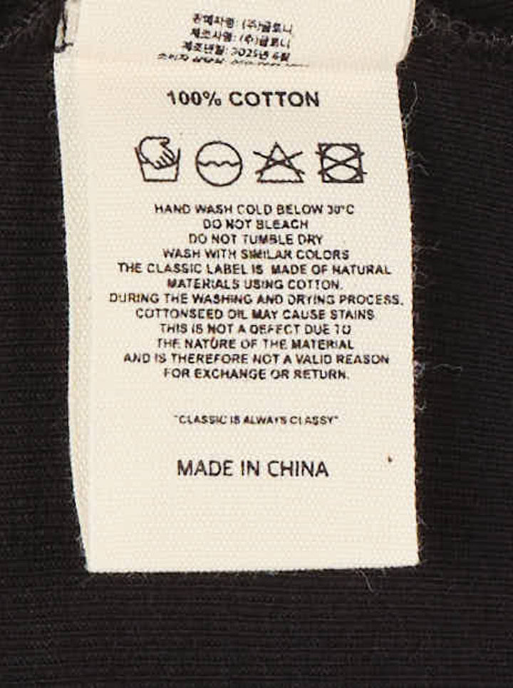 Glowny Classic Tank Top in black, featuring a square neckline, thin straight straps, fitted silhouette, and a woven Glowny label at the hem, photographed flat on a white background - view 3