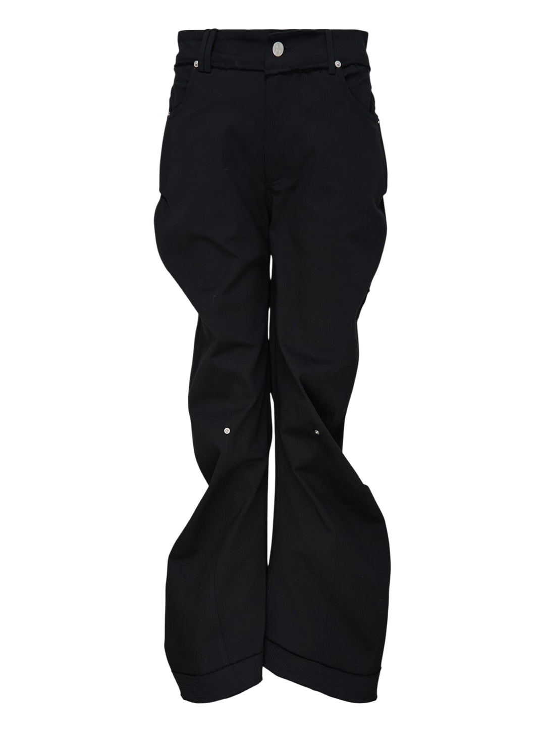 Nache Rawcut Curved Pants in black, featuring a sculpted bowed leg, raw-cut waistband, metal button closure and rivet details, shown from the front