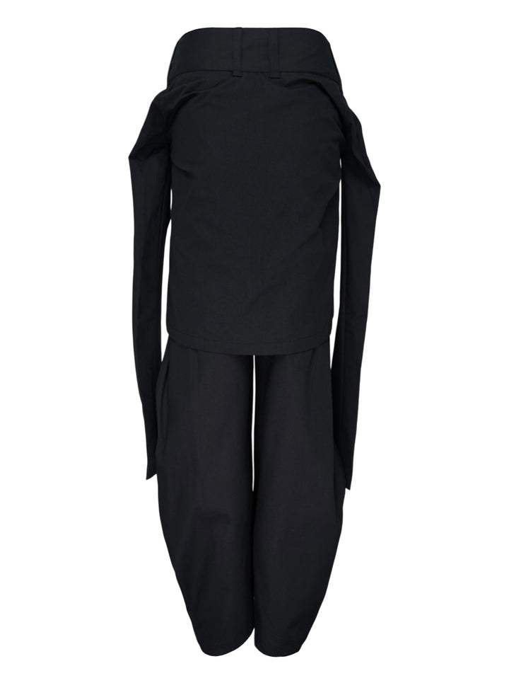 Nache Tied Shirt Pants in black, shown from the front with high waist, double snap closure and draped sleeve ties at the hips - view 2