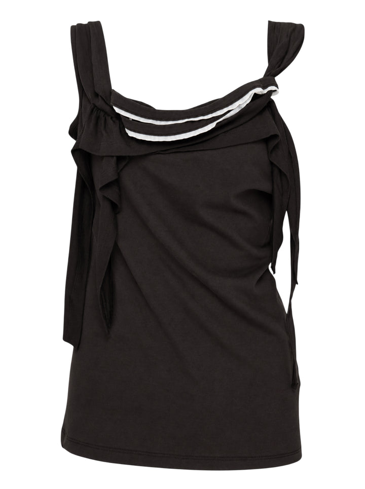 Black sleeveless jersey top with raw-cut ruffles, knotted straps and white piped draped neckline
