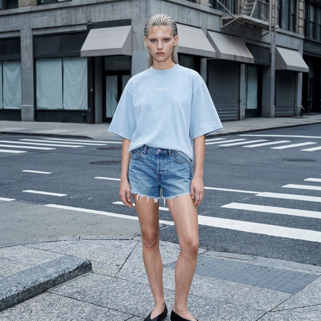 Alexander Wang oversized washed black short sleeve tee with centre chest logo print on white background - lifestyle