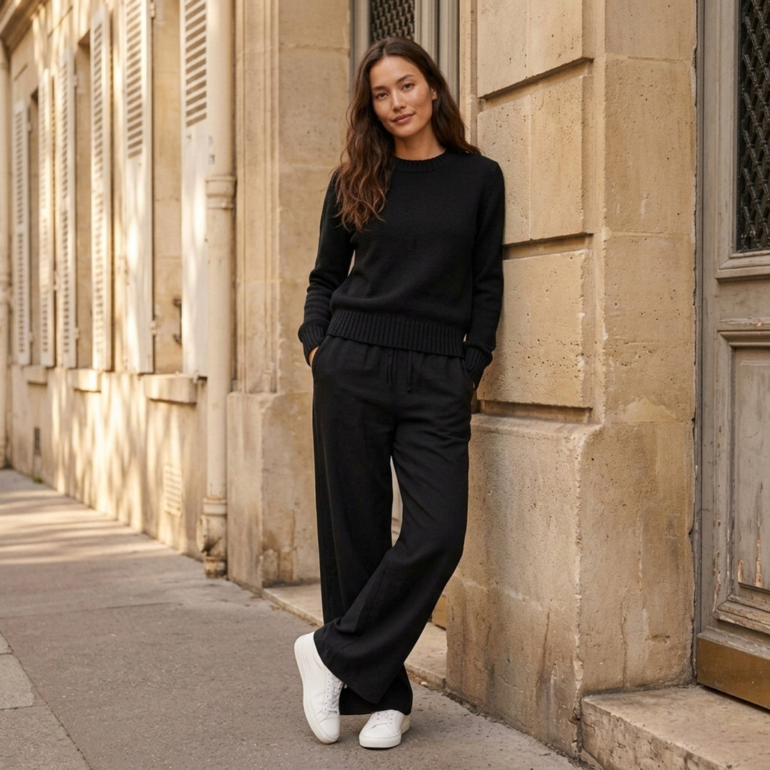 AMI black crewneck sweater in chunky knit with ribbed collar, cuffs and hem, shown flat from the front - lifestyle