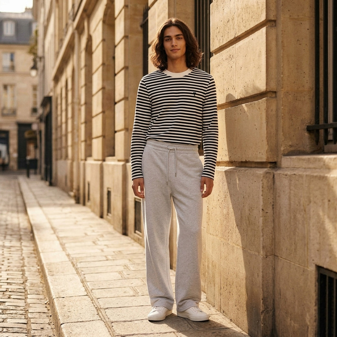 AMI Contrast Wide Leg Sweatpants in black with elasticated drawstring waistband and wide straight-cut silhouette, shown flat against a white background - lifestyle