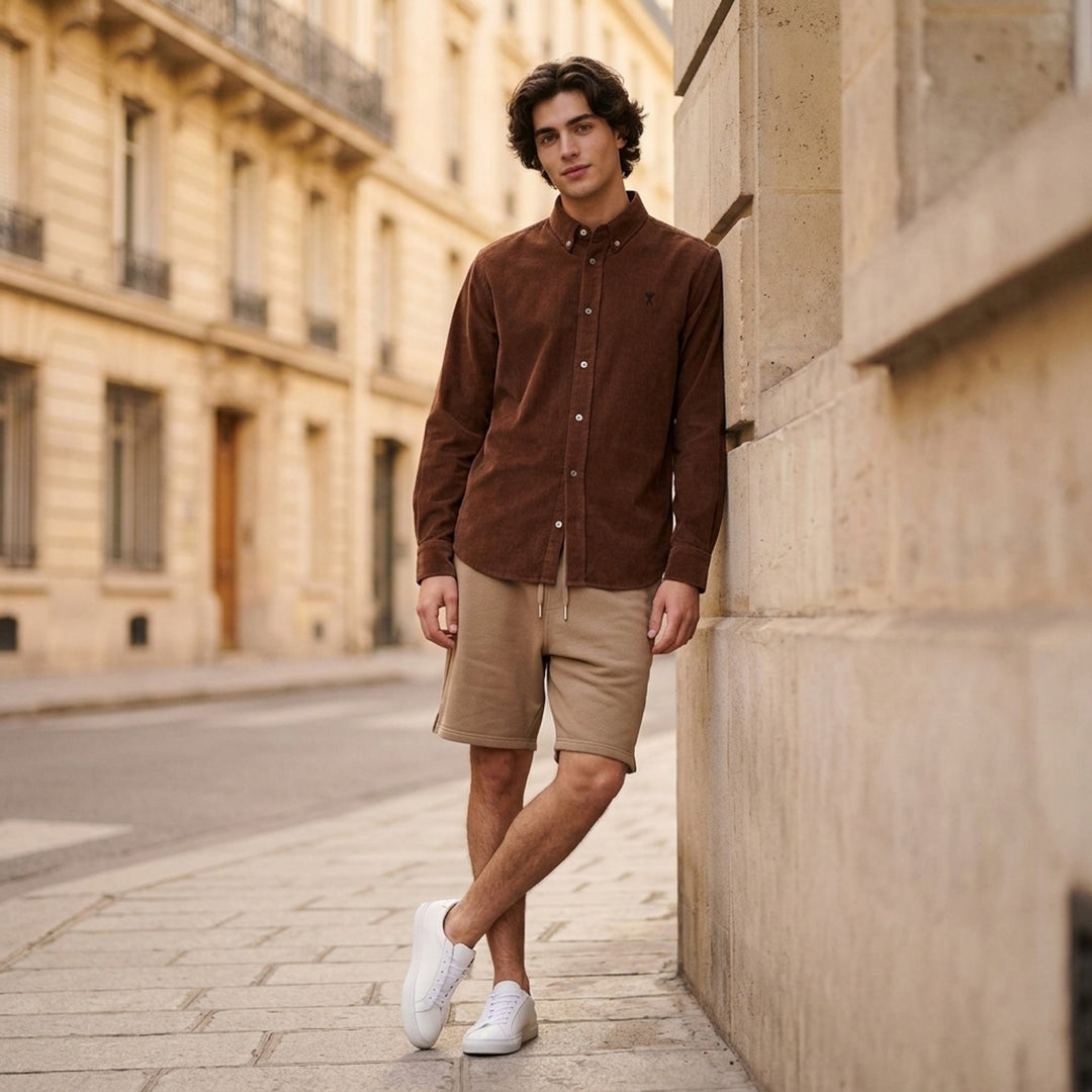 AMI Alexandre Mattiussi fine-wale corduroy button-down shirt in camel with embroidered Ami de Cœur logo at the chest and button-down collar - lifestyle