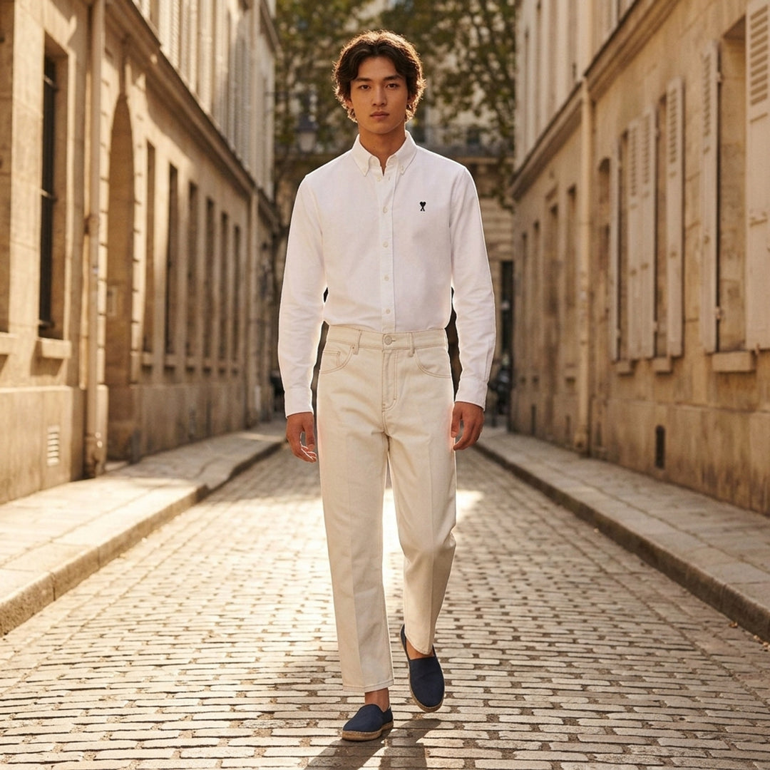 AMI Paris pale blue long sleeve Oxford button-down collar shirt with embroidered Ami de Cœur logo on the chest - lifestyle