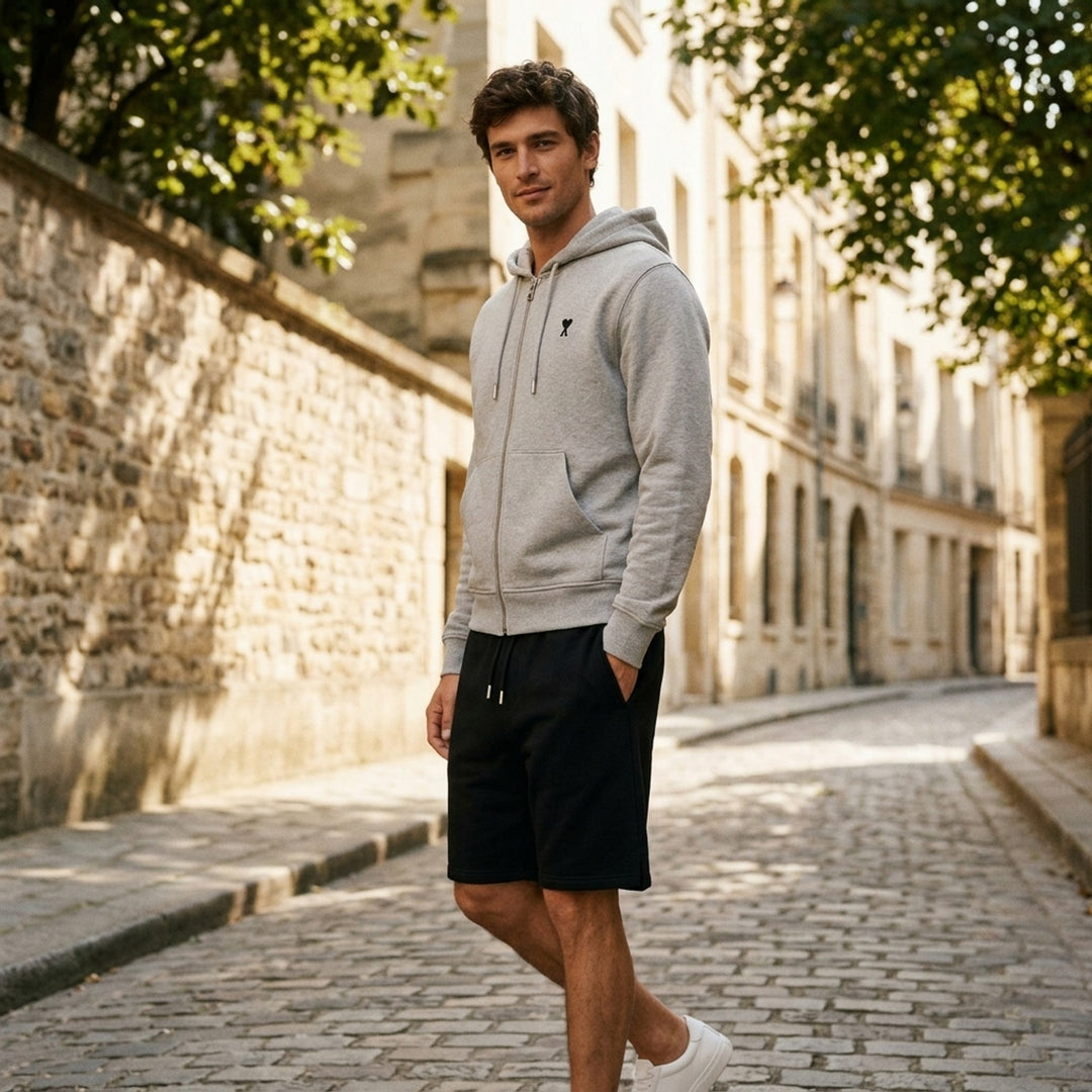 Ami Alexandre Mattiussi black zip-up hoodie with embroidered Ami de Cœur logo, silver zip hardware, adjustable drawstring hood, and kangaroo pocket - lifestyle