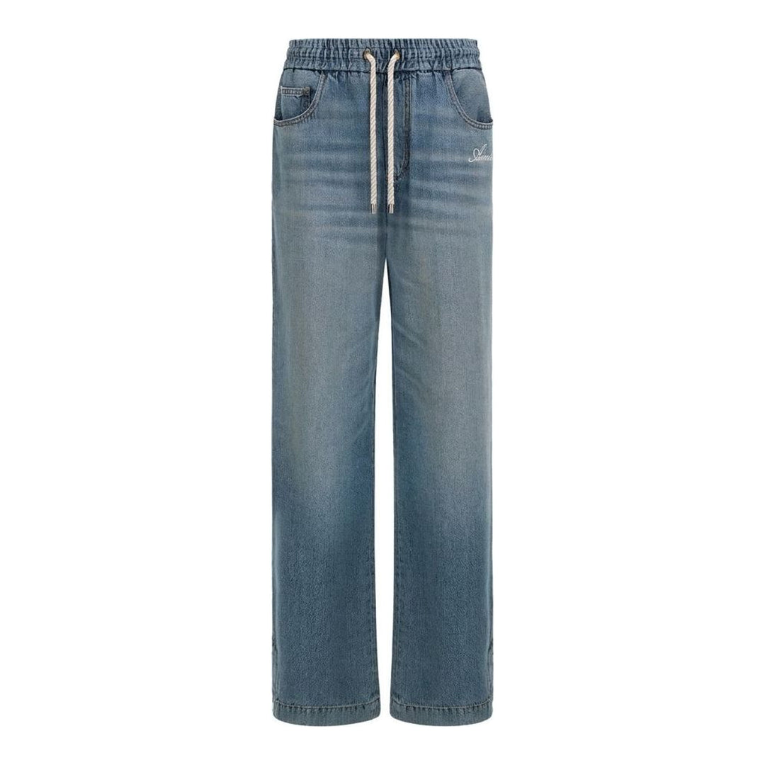 Amiri baggy drawstring jeans in washed light-blue denim with an elasticated waist, white rope drawcord and embroidered script logo at the hip - packshot