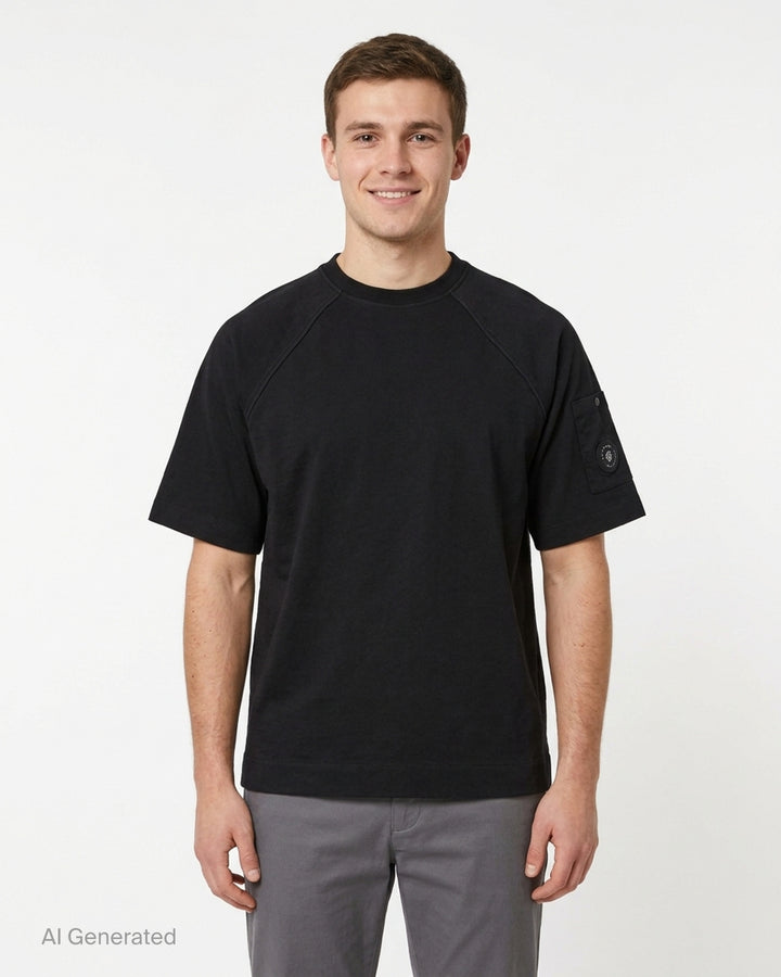 C.P. Company black mercerized cotton jersey raglan t-shirt with snap-fastened sleeve pocket and lens badge, front view - front