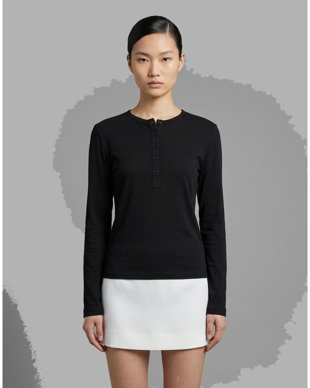 Black long sleeve cotton jersey Henley top with round neckline and five-button placket by Club21 Collection - front