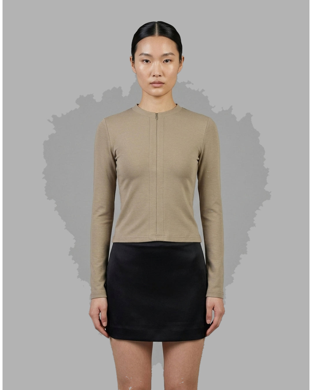 Black long sleeve zip-front top in high stretch modal jersey with a crew neckline and vertical front seams - front