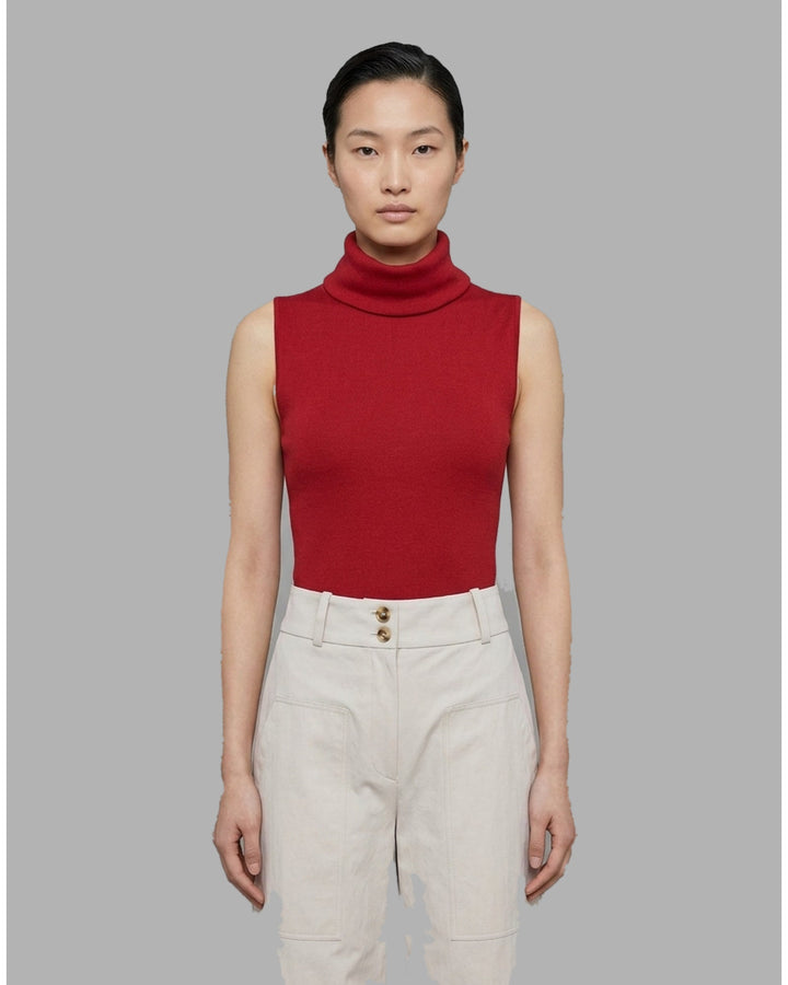 Black sleeveless roll neck knit top in fine ribbed silk cotton yarn, shown flat from the front - front