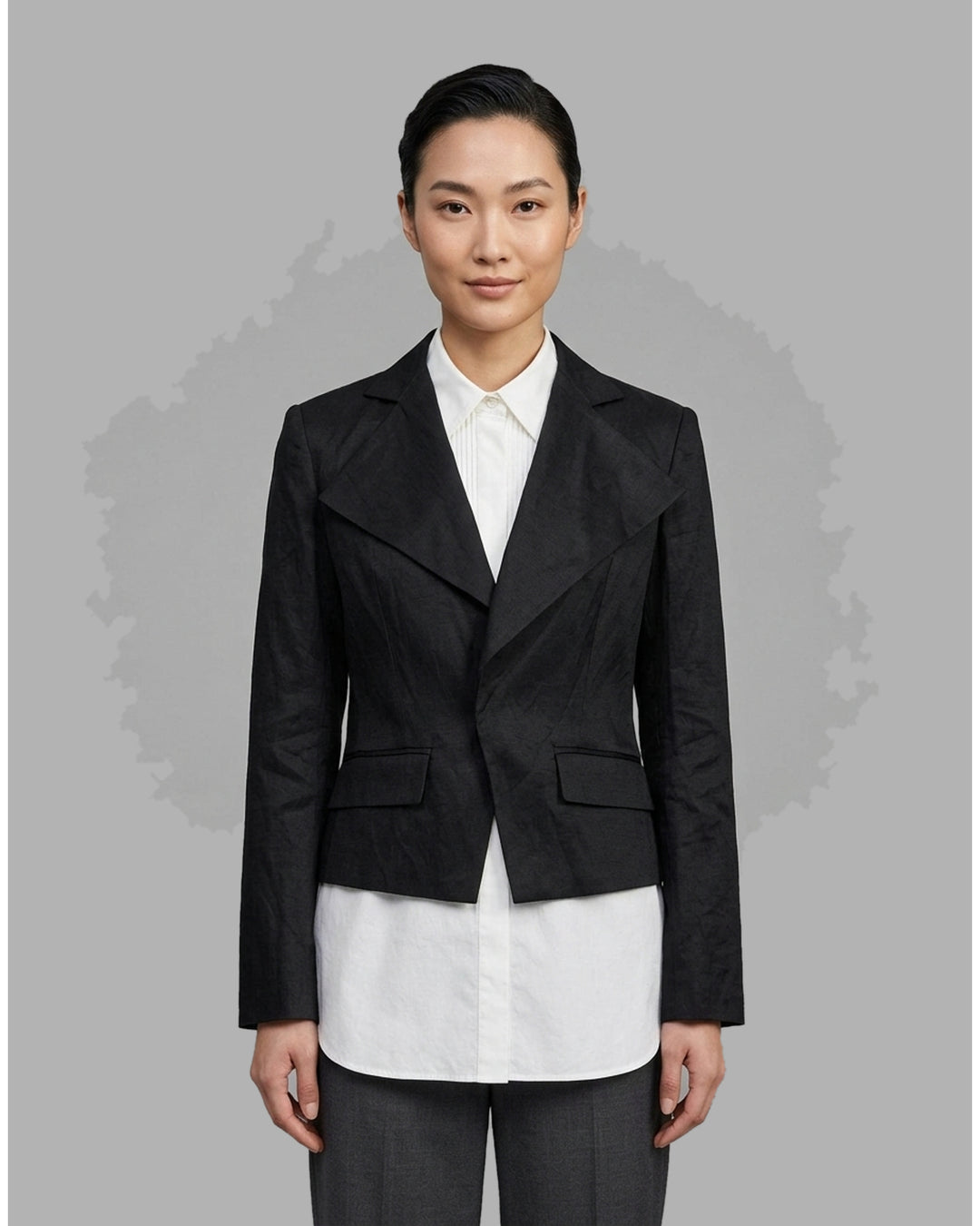 Black cropped blazer with wide notched lapels, flap pockets and a crinkled finish from Club21 Collection - front