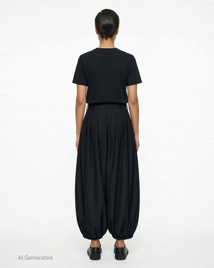 Comme des Garçons black balloon trousers with pleated high waist, voluminous silhouette, and elasticated gathered hems, shot flat on white background - back