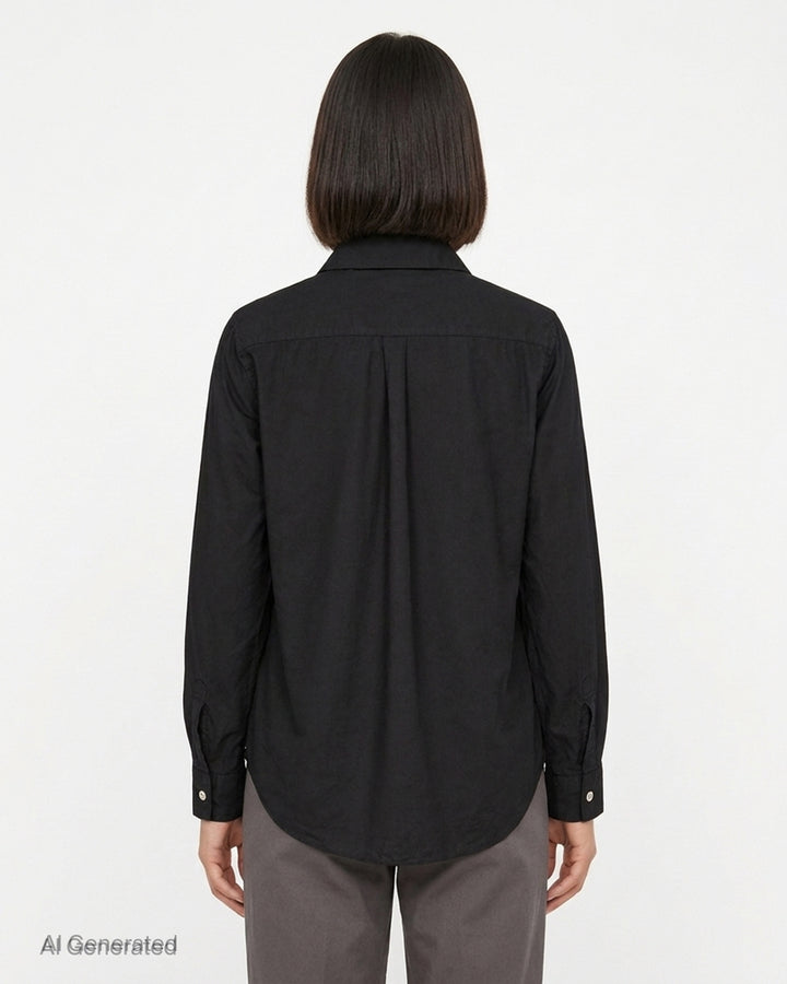 Black pleated button-down shirt with rounded collar, pale buttons and frayed pleated hem by Comme des Garçons Comme des Garçons - back