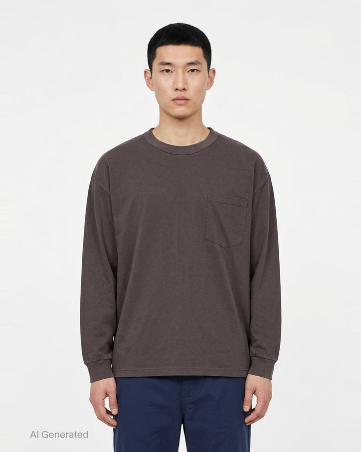 Comme des Garçons Homme slightly brushed cotton jersey long sleeve tee in taupe with crew neck, chest patch pocket, and ribbed cuffs - front