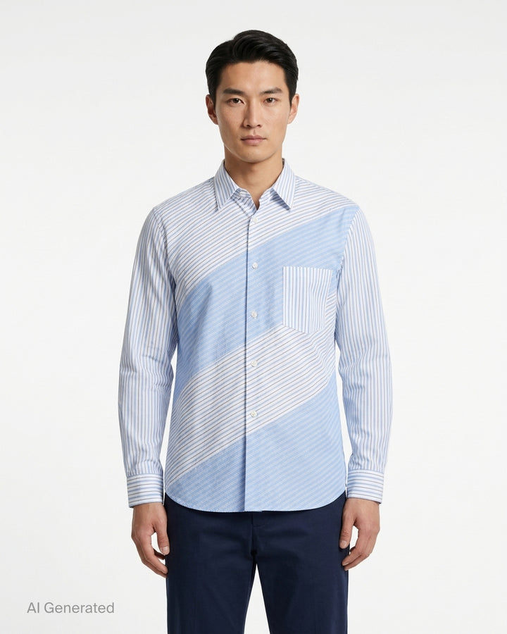 Comme des Garçons Homme Deux long sleeve shirt in blue and white cotton broad stripe with diagonal patchwork panels and a chest pocket - front