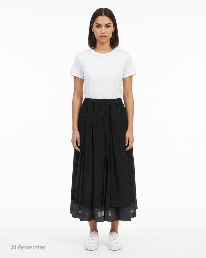 Comme des Garçons black pleated midi skirt with elasticated waist and sheer layered hem - front