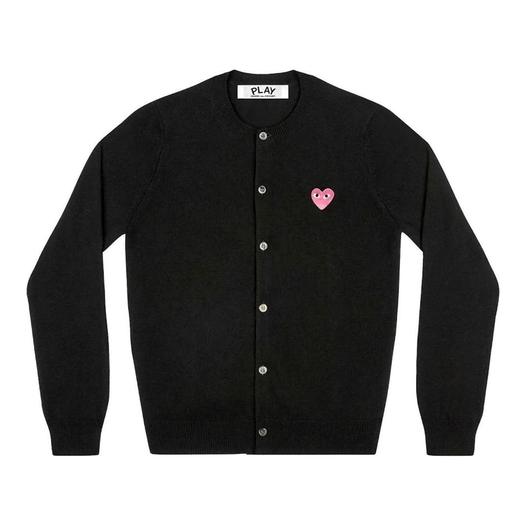 Comme des Garçons PLAY black round neck cardigan with embroidered pink heart emblem patch and button-through front fastening, flat lay view - packshot