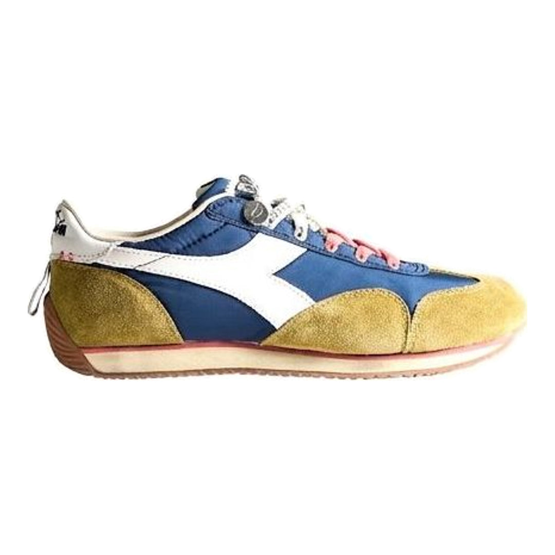 Diadora x JW Anderson retro nylon sneaker in blue with khaki suede overlays, coral laces, and a white Diadora logo stripe, set against a white background - packshot