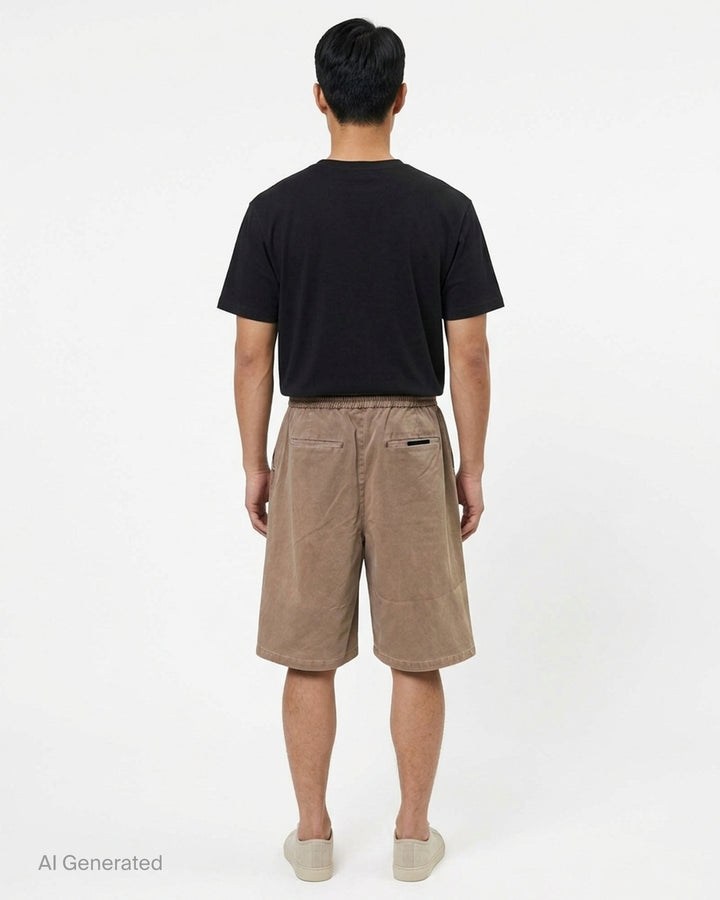 Fear of God Essentials Lounge Drawstring Shorts in garment-washed taupe with elasticated waistband, rope drawstring, and tonal logo embroidery - back