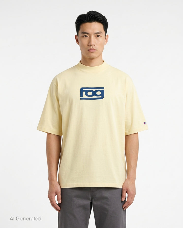 Fear of God ESSENTIALS Panelled Modern Tee in deep teal with a yellow logo graphic at the chest, shown from the front - front