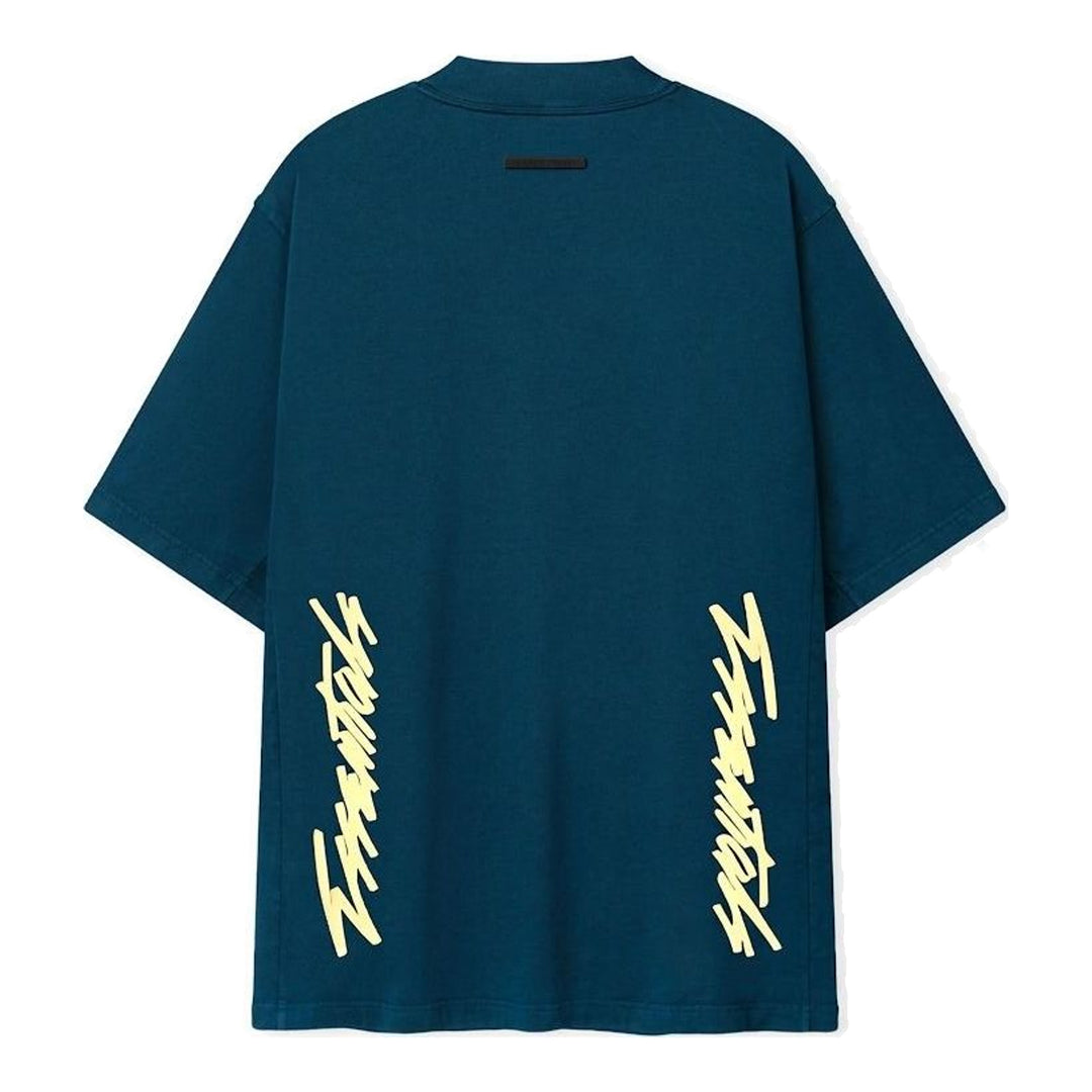 Fear of God ESSENTIALS Panelled Modern Tee in deep teal with a yellow logo graphic at the chest, shown from the front - packshot