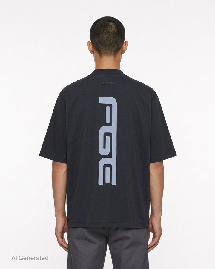 Fear of God Essentials Racing Panelled Modern Tee in black with a mock neck, oversized short sleeves, tiered hem and grey "Fear of God Racing" graphic on the chest - back