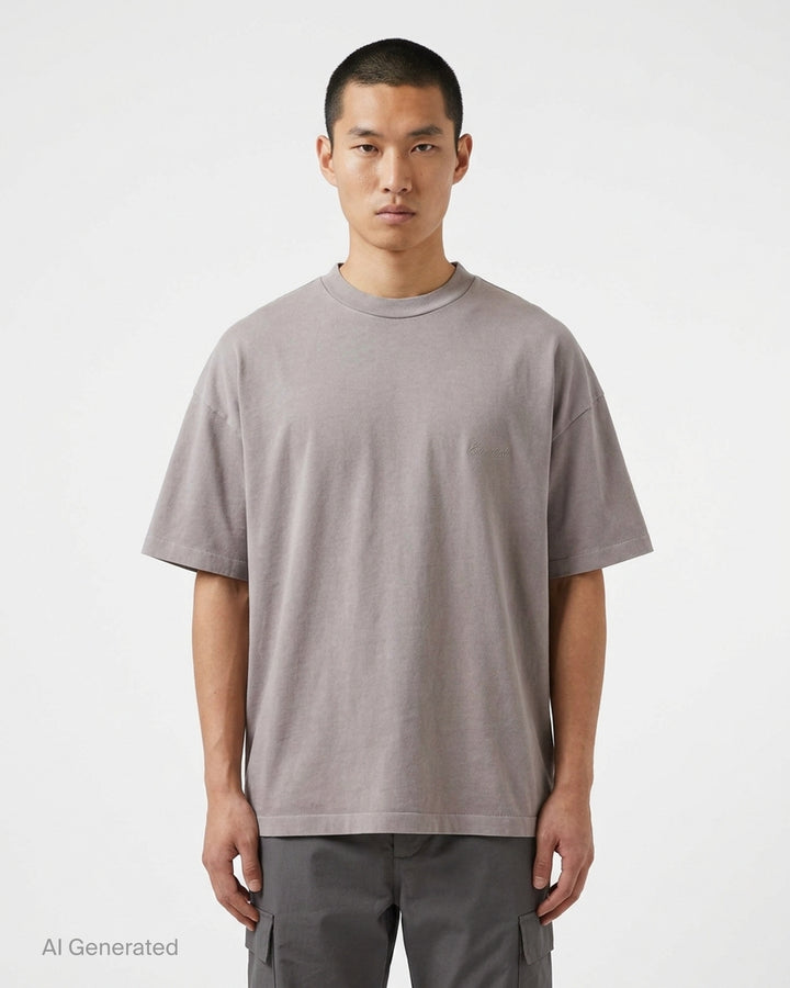 Fear of God Essentials Signature 90's Short Sleeve Tee in washed charcoal with oversized boxy fit and tonal embroidered script logo on the chest - front