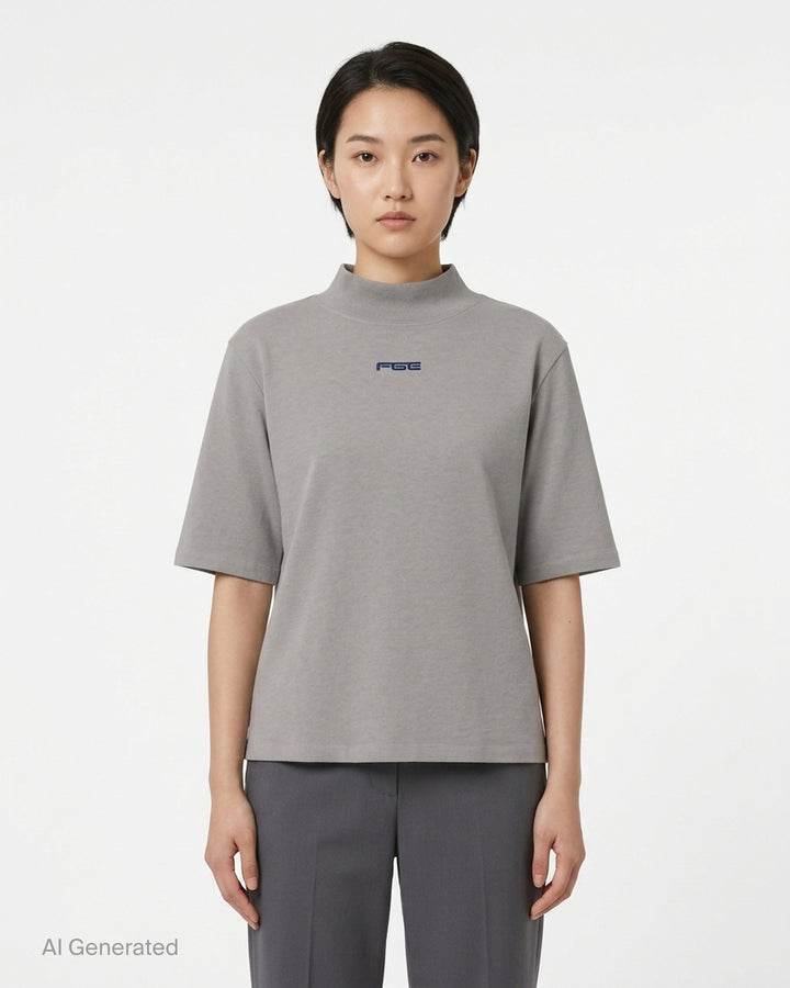Fear of God ESSENTIALS women's slim mockneck tee in black with ribbed high neck, short sleeves and small white logo at the centre chest - front