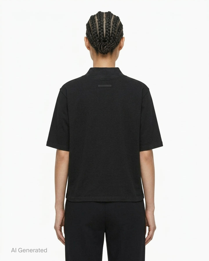 Fear of God ESSENTIALS women's slim mockneck tee in black with ribbed high neck, short sleeves and small white logo at the centre chest - back