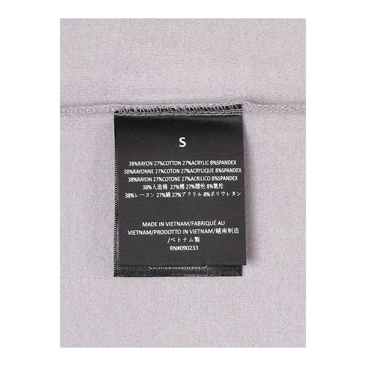 Fear of God Essentials women's tight tee in heathered taupe-grey with mock neckline and short sleeves, shown flat against a white background - packshot