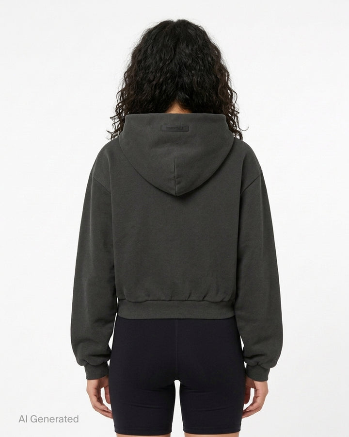 Fear of God Essentials women's modern cropped zip hoodie in washed black with embroidered script Essentials logo on the chest and front hand pockets - back