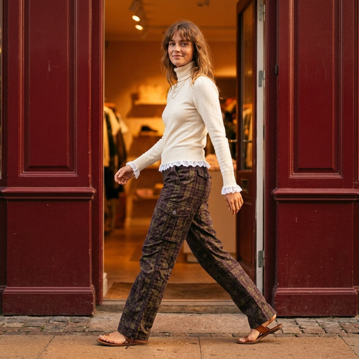 Ganni Stretch Cotton Cargo Pants in olive and burgundy mixed tartan and floral paisley print with cargo patch pockets and drawstring ankles, flat lay front view - lifestyle