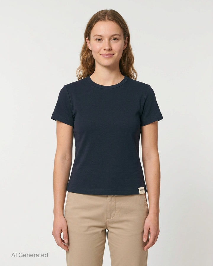Glowny Classic Baby Tee in black — slim-fit cropped silhouette with a ribbed crew neck, short sleeves, and a woven Glowny label at the hem - front