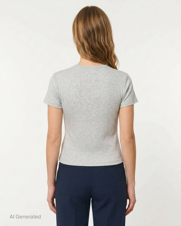 Glowny Classic Baby Tee in black — slim-fit cropped silhouette with a ribbed crew neck, short sleeves, and a woven Glowny label at the hem - back