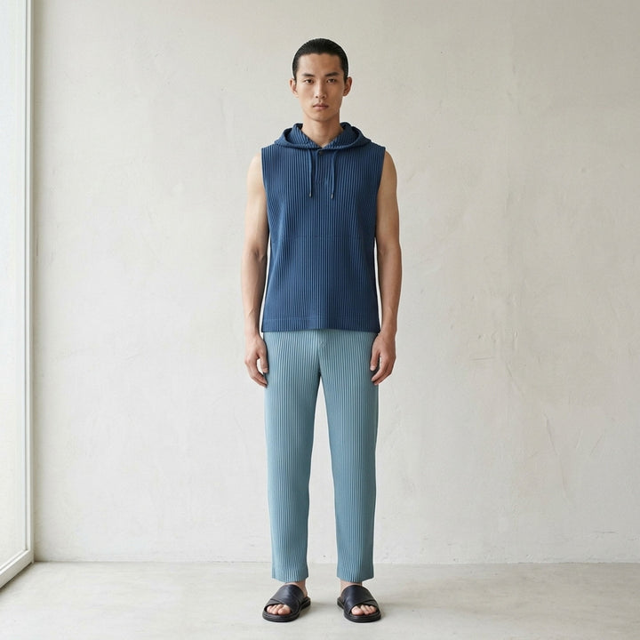 Homme Plissé Issey Miyake Color Pleats 2 pleated pants in teal with signature vertical steam pleats and elastic waistband, straight-leg silhouette, front view - lifestyle